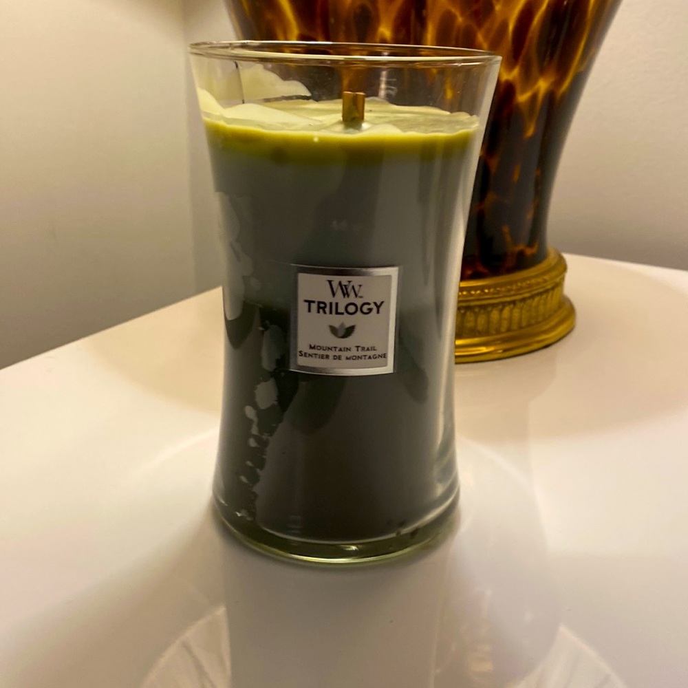 Wood Wick Large Trilogy candle. Scent: Mountain Trail. No tops. Crack in glass.